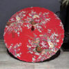 Traditional cotton parasol made of bamboo with bright red peony